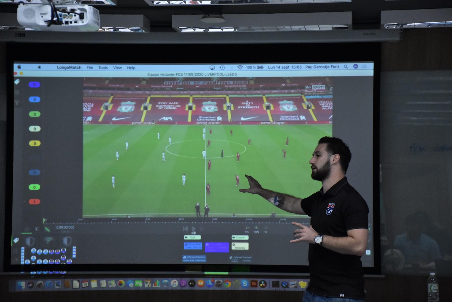 Pau Garnatje Font presenting tagged match video to a group on a projector screen